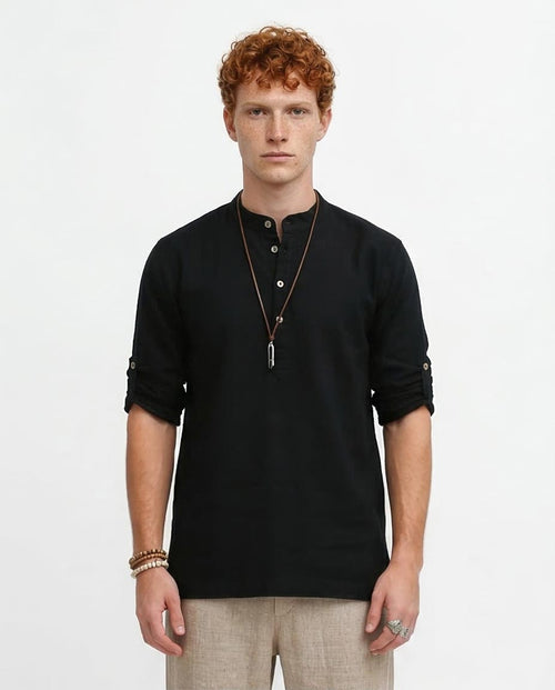 Man wearing a black long-sleeve shirt on a white background