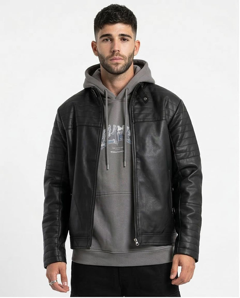 Man wearing a black leather jacket over a gray hoodie on a white background