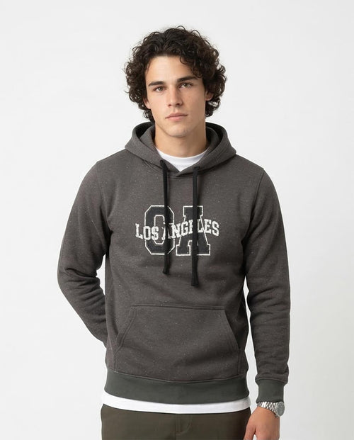 Man wearing a gray hoodie with 'Los Angeles' text on a white background