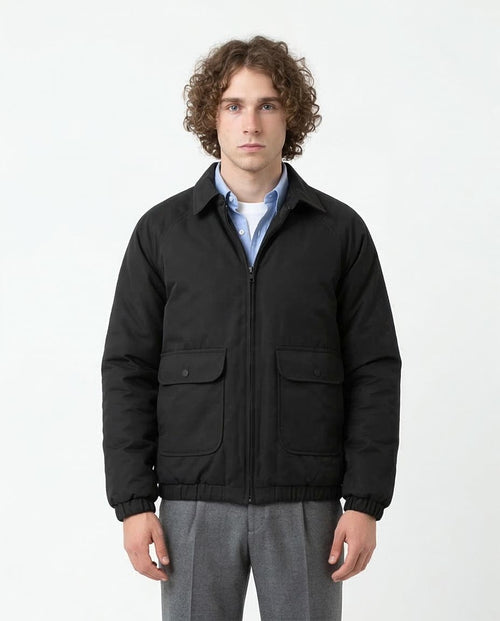 Man wearing a black jacket on a white background