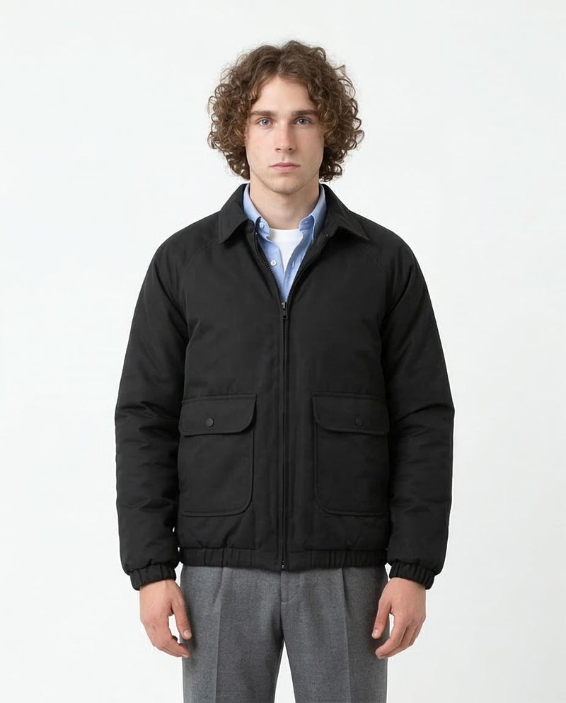 Man wearing a black jacket on a white background