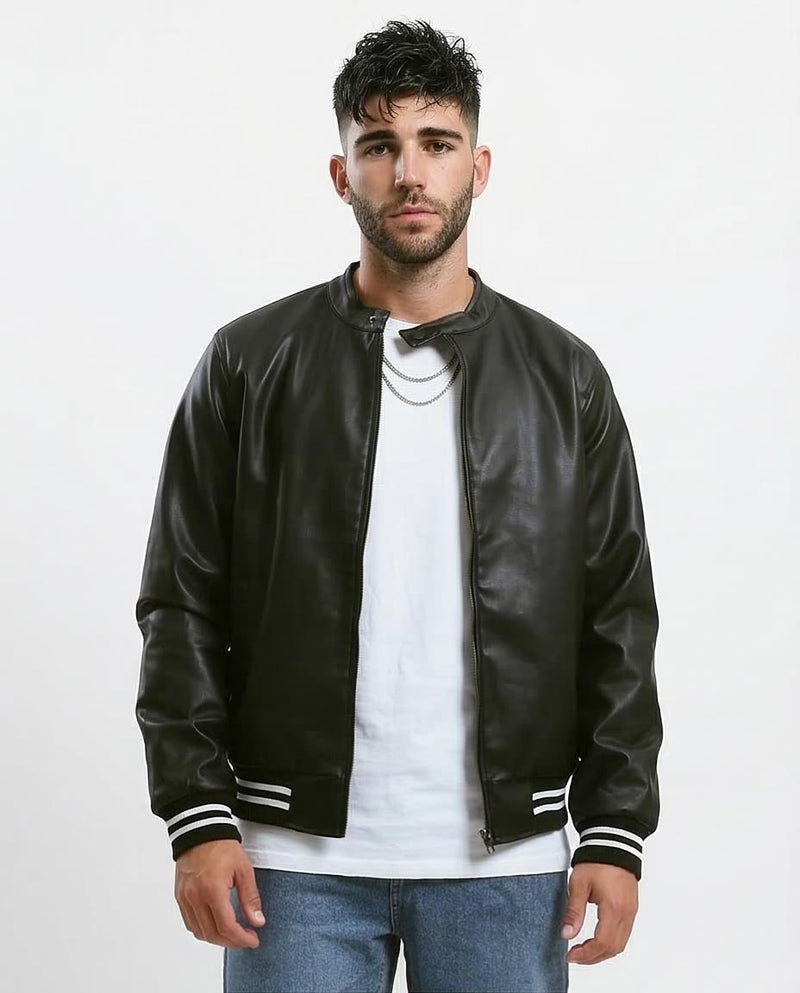 Man wearing a black leather bomber jacket with white stripes on a white background
