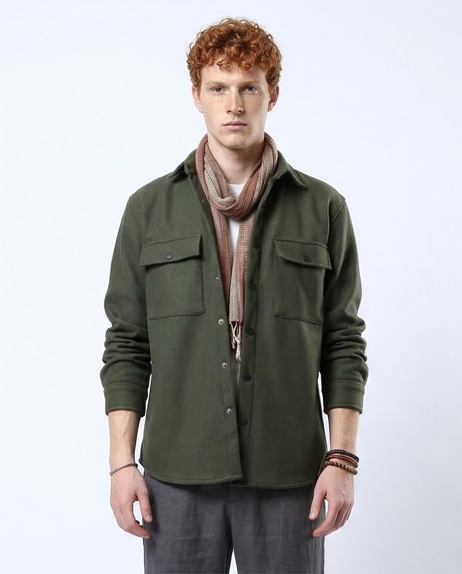 Man wearing a green shirt with a scarf on a white background