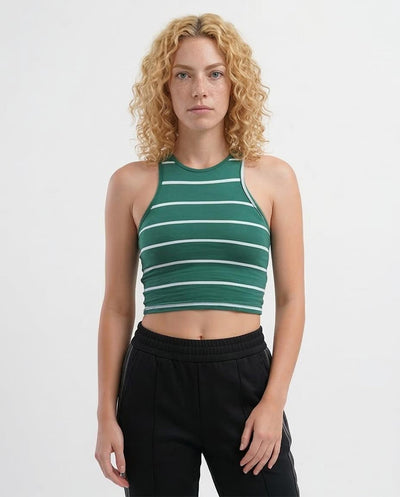 Woman wearing a green and white striped tank top against a white background
