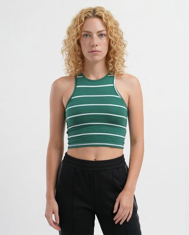 Woman wearing a green and white striped tank top against a white background