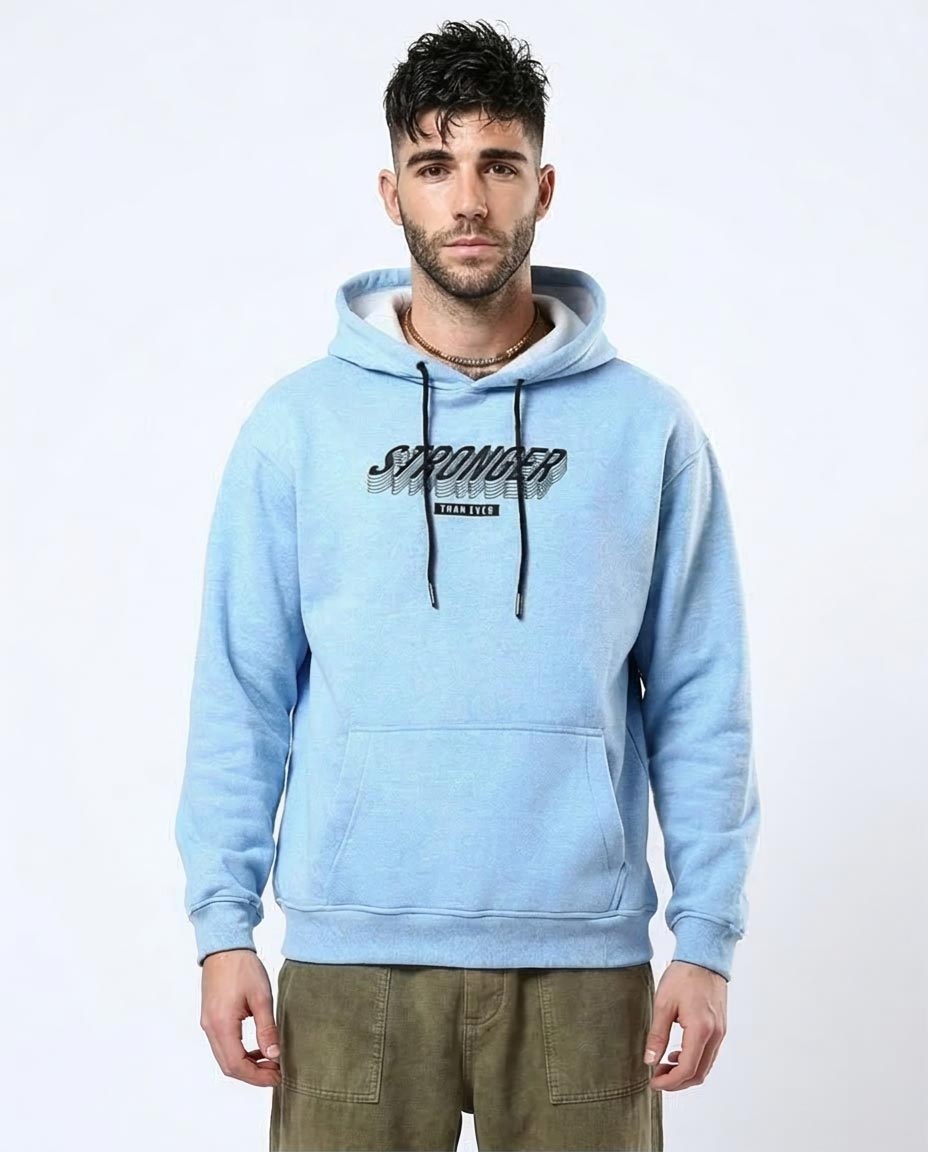 Man wearing a light blue hoodie with text on a white background