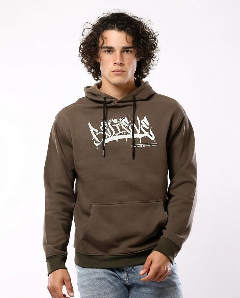 Man wearing a brown hoodie with a logo on a white background