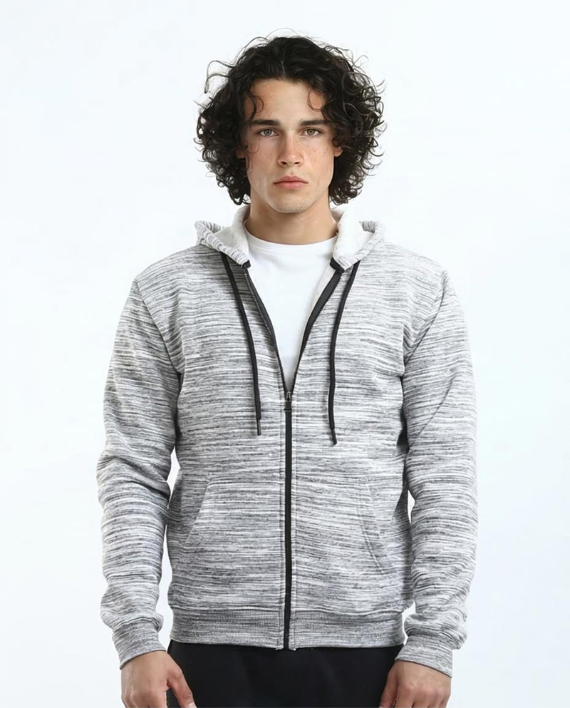 Man wearing a gray zip-up hoodie with a white shirt underneath on a light gray background