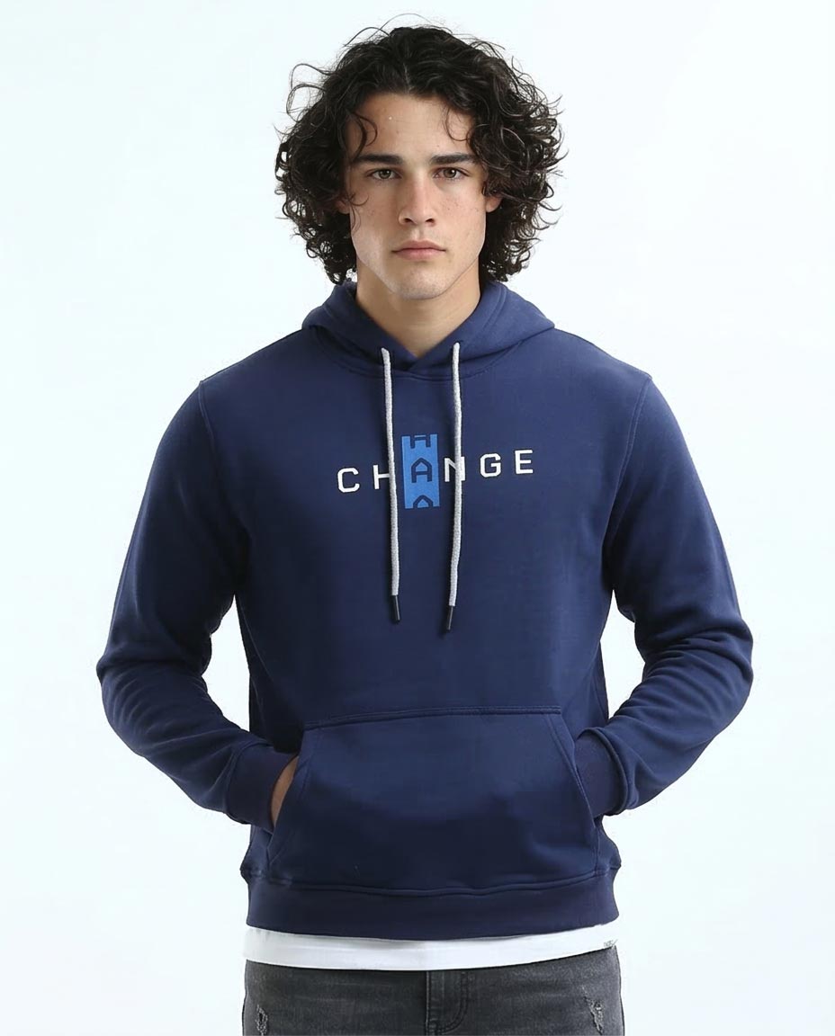 Man wearing a blue hoodie with 'Change' text on a white background
