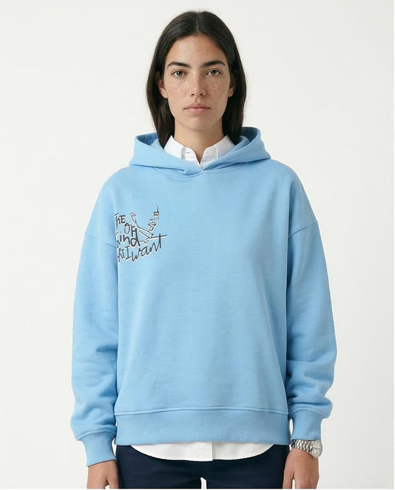 Woman wearing a light blue hoodie with text on a white background