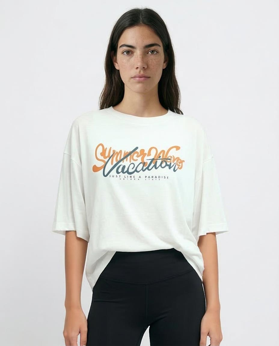 Woman wearing a white t-shirt with 'Summer Vacation' text on a plain background