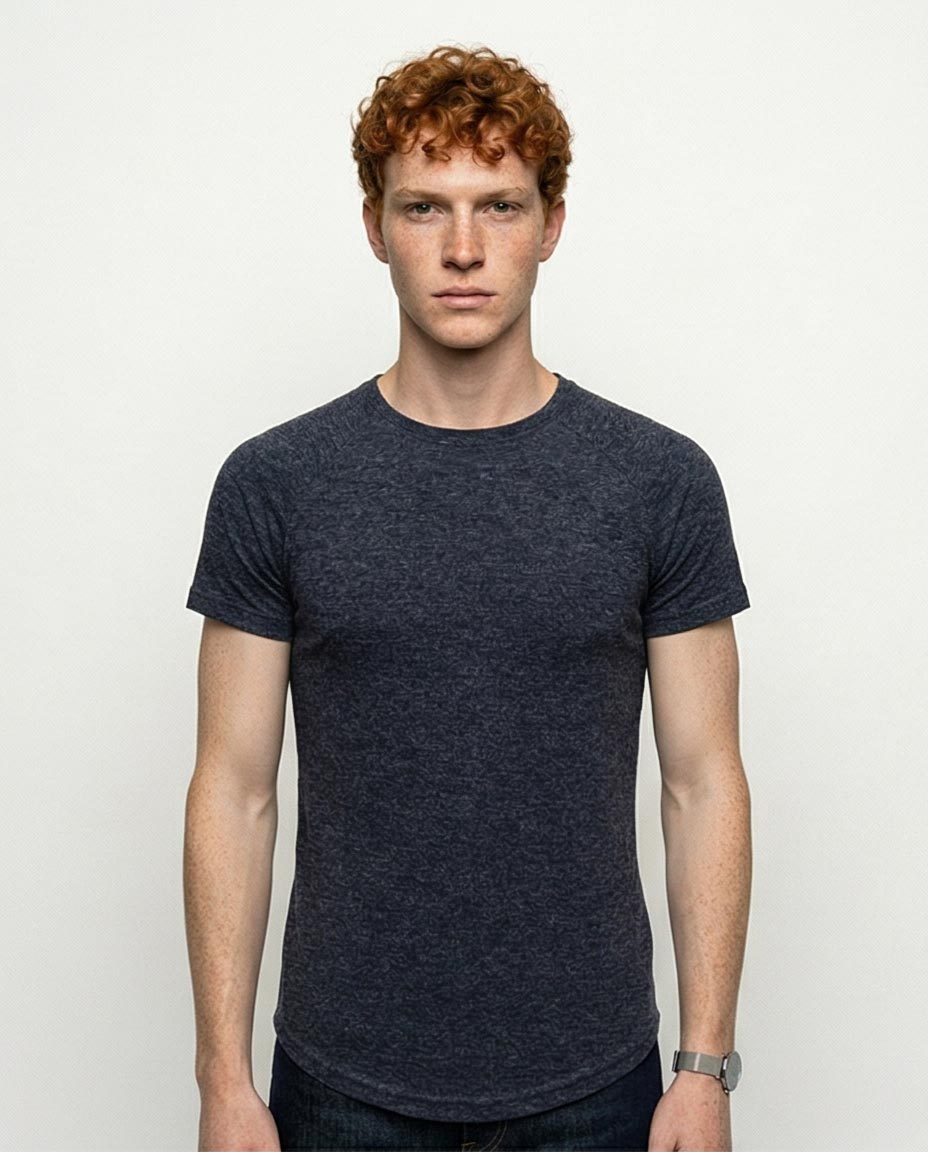 Man wearing a dark blue t-shirt against a plain background