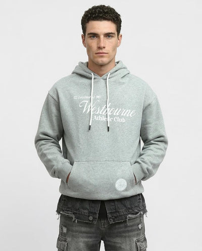 Man wearing a gray hoodie with 'Westbourne Athletic Club' text on a light gray background