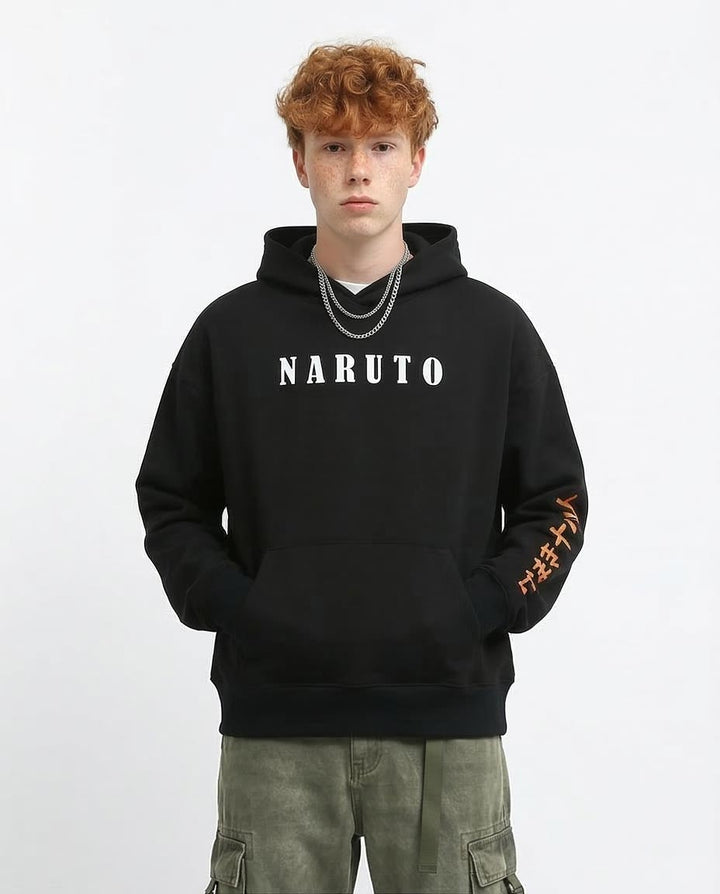 Person wearing a black hoodie with 'NARUTO' text on a white background