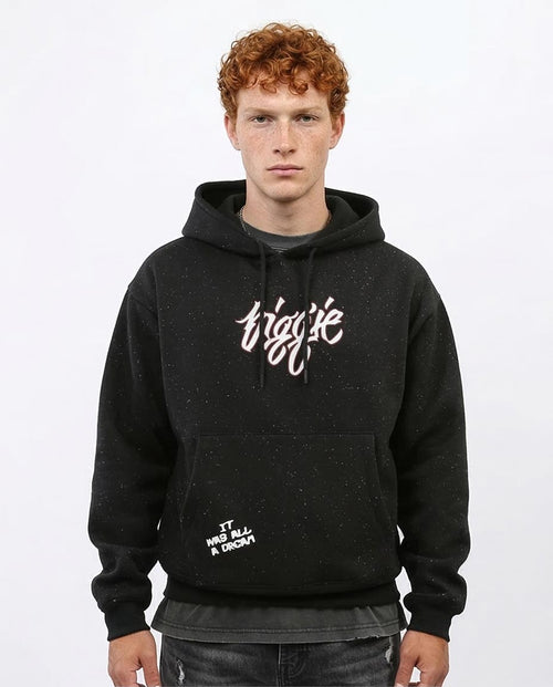 Person wearing a black hoodie with white text on a white background