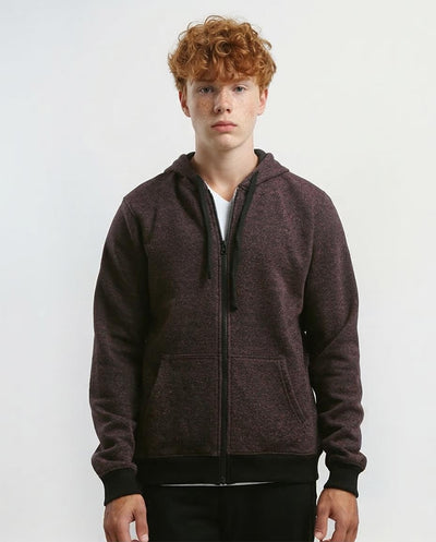 Person wearing a dark brown zip-up hoodie on a white background