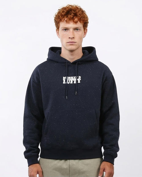 Person wearing a navy hoodie with text on a white background