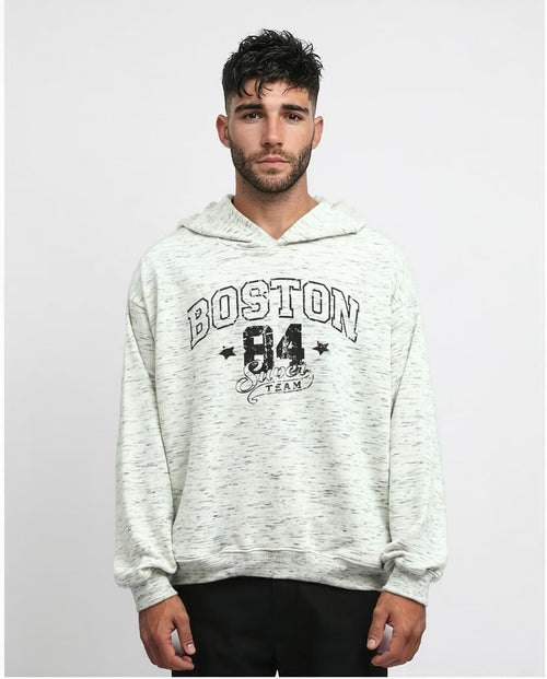 Man wearing a gray hoodie with 'Boston 84' text on a white background