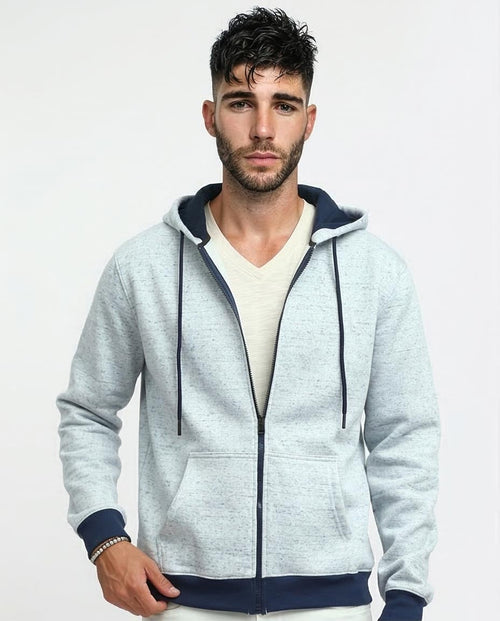 Man wearing a gray hoodie with navy accents on a light gray background