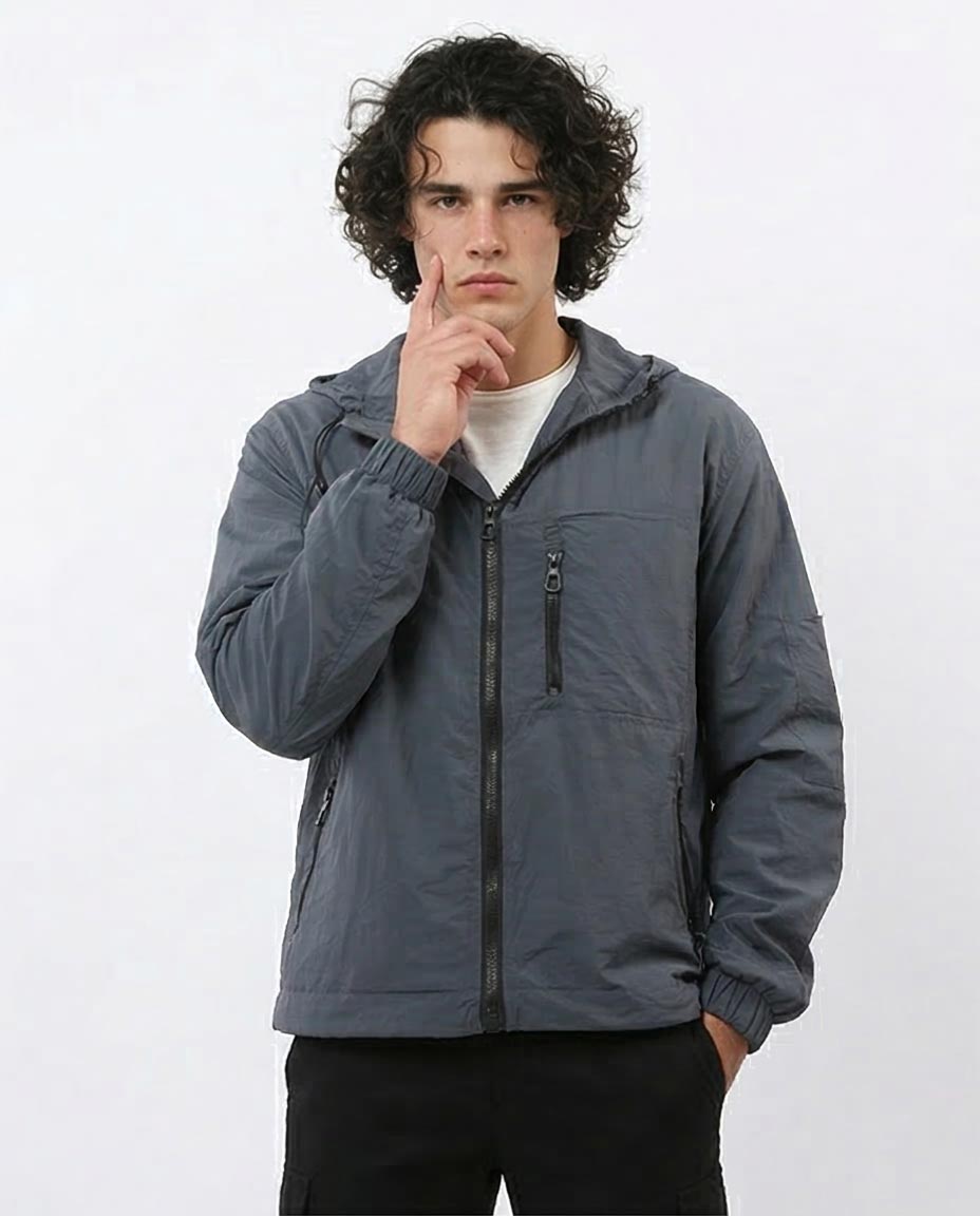 Man wearing a gray jacket on a white background