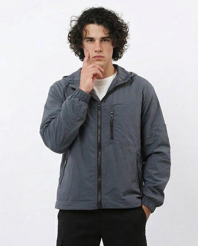 Man wearing a gray jacket on a white background