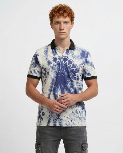 Man wearing a tie-dye polo shirt with black trim on a white background