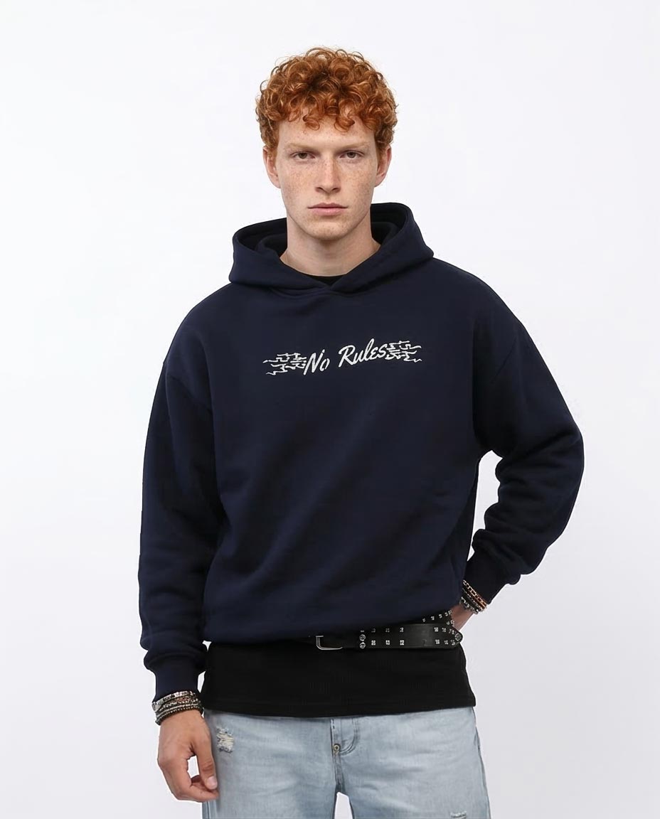 Man wearing a navy hoodie with text on a white background