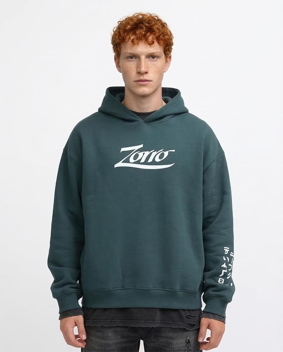Person wearing a green hoodie with 'Zorro' logo on a white background
