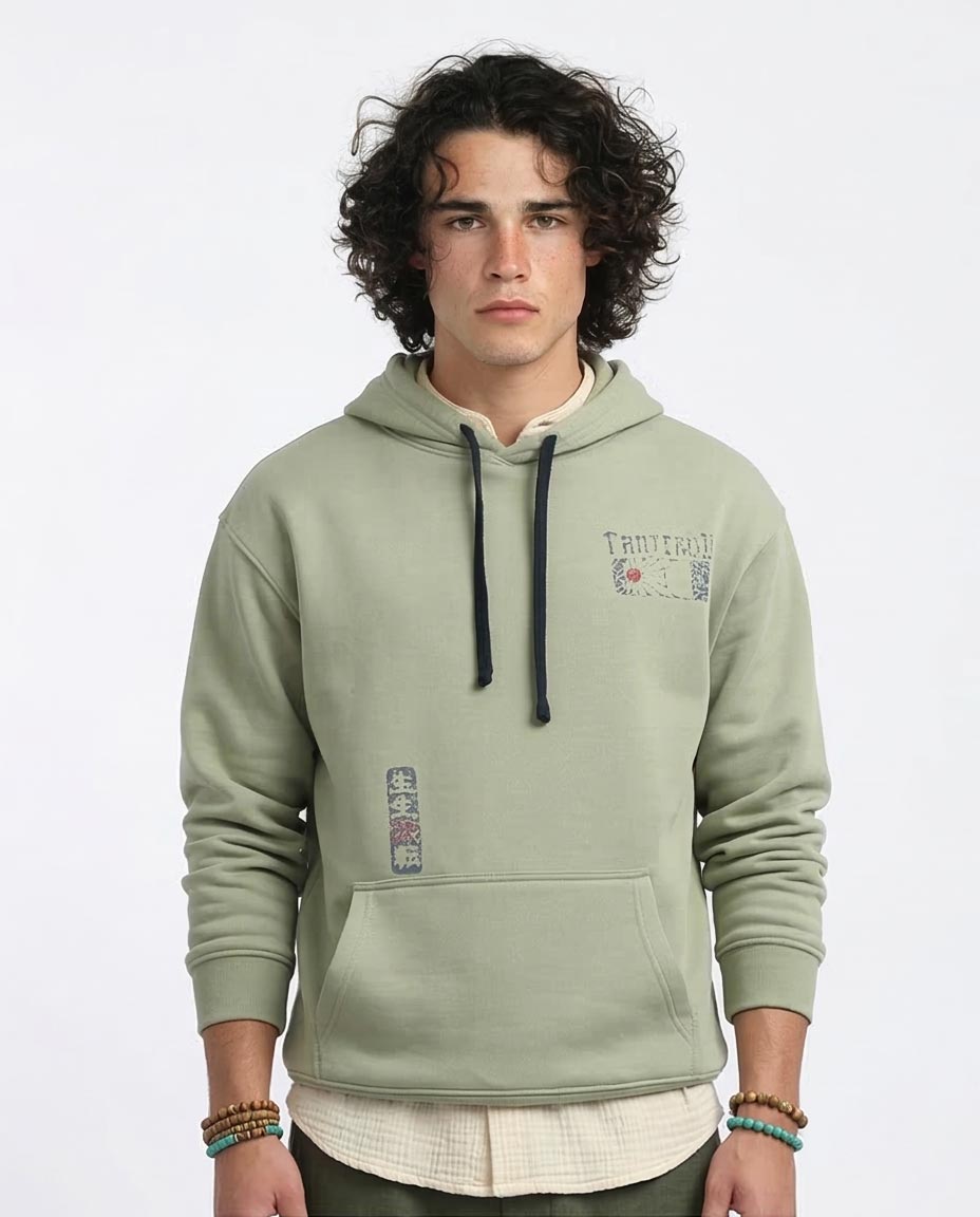 Man wearing a green hoodie with text and graphics on a white background