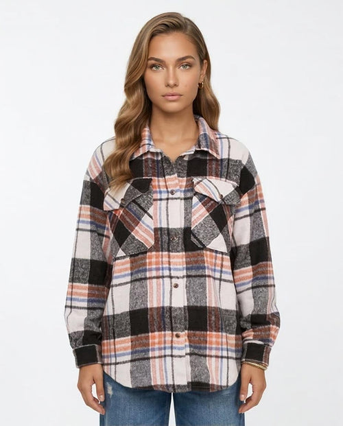 Woman wearing a plaid shirt on a white background