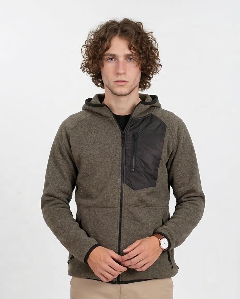 Man wearing a brown hoodie with a black patch on a white background