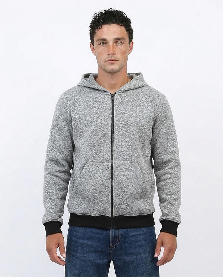 Man wearing a gray zip-up hoodie on a white background