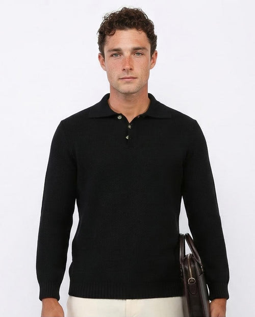 Man wearing a black long-sleeve polo shirt against a white background