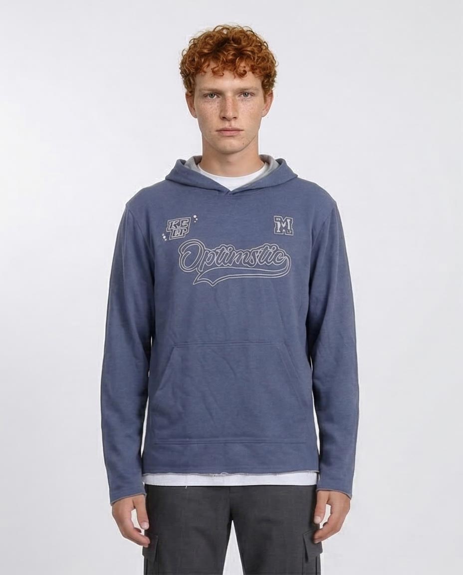 Person wearing a blue hoodie with text on a white background