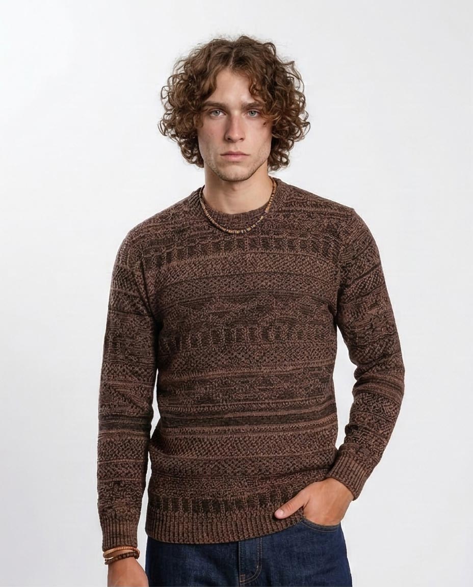 Man wearing a brown patterned sweater against a white background
