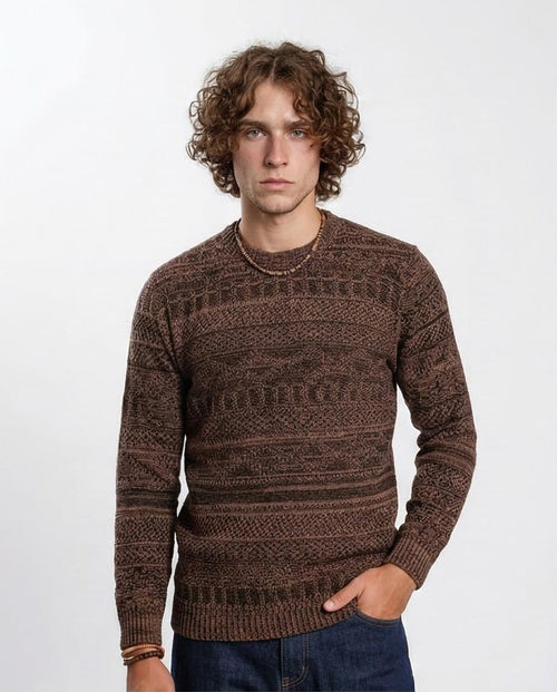 Man wearing a brown patterned sweater against a white background