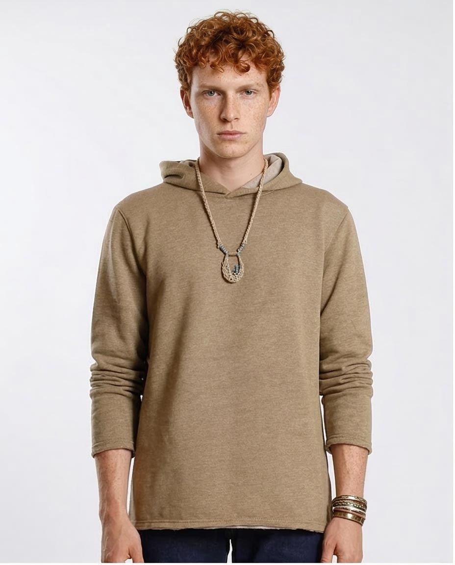 Man wearing a beige hoodie on a white background