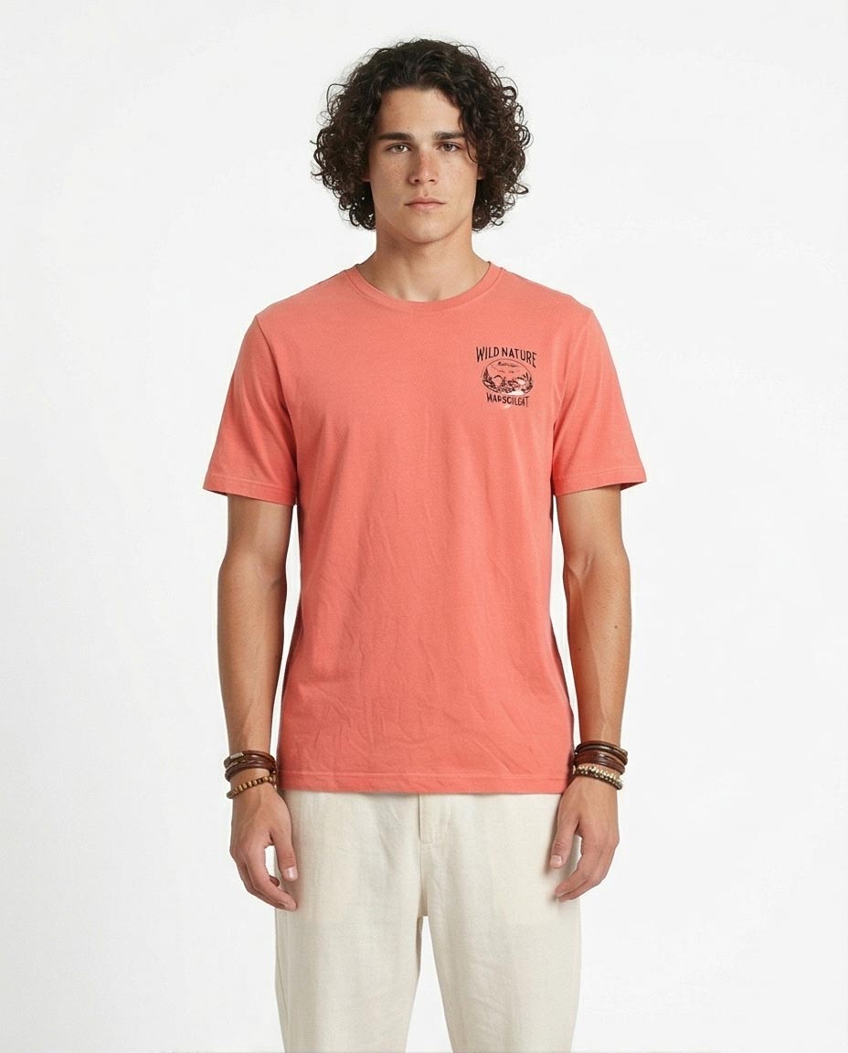Man wearing a coral t-shirt with a graphic design on a white background
