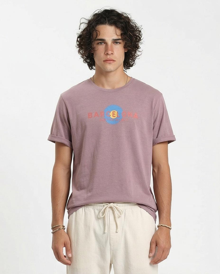 Man wearing a purple t-shirt with a logo on a white background
