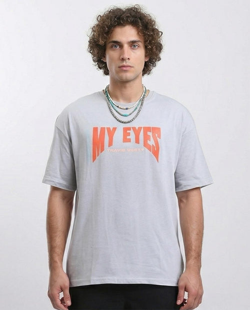 Man wearing a gray t-shirt with 'MY EYES' text in orange on a white background