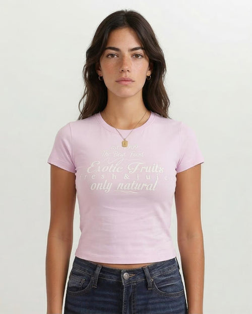 Woman wearing a pink t-shirt with text on a white background
