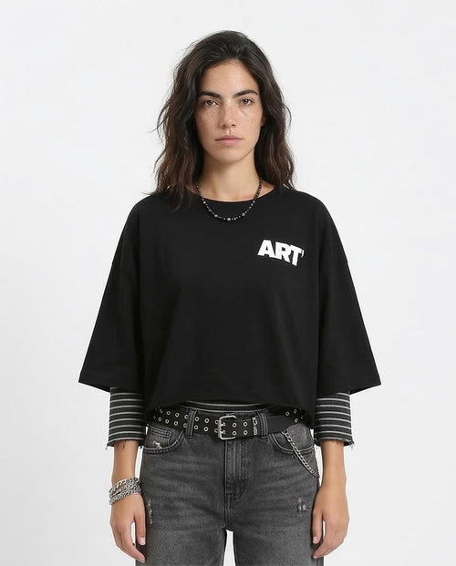Person wearing a black sweater with 'ART' text on a white background