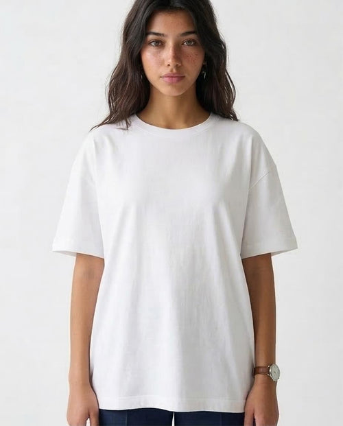 Woman wearing a plain white t-shirt against a white background