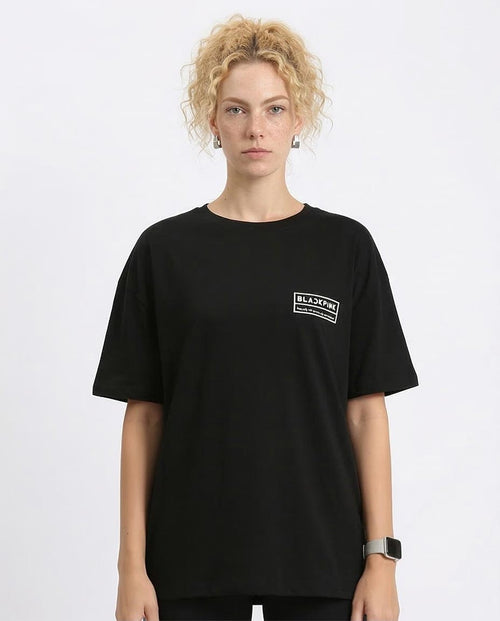 Person wearing a black t-shirt with a logo on a white background