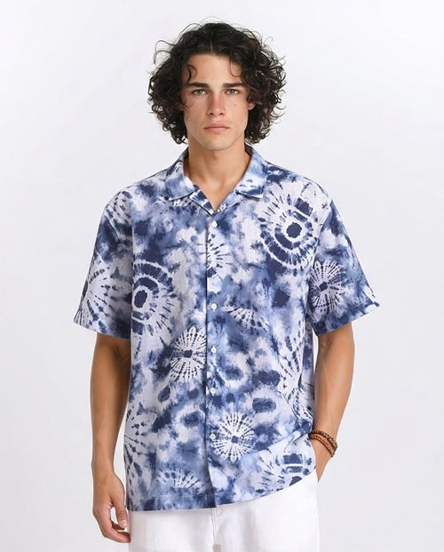 Man wearing a blue tie-dye shirt on a white background