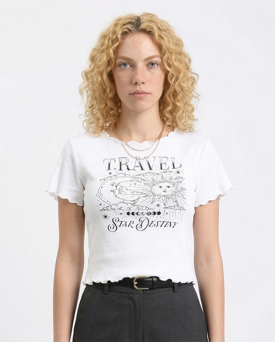 Woman wearing a white t-shirt with a graphic design and text on a plain background