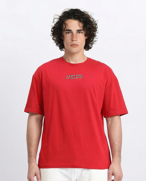 Person wearing a red t-shirt with text on a white background