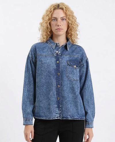 Woman wearing a blue denim shirt on a white background