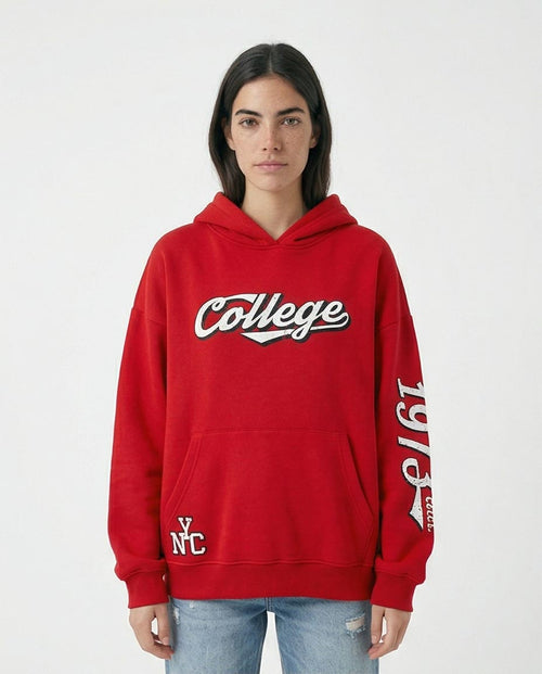 Person wearing a red hoodie with 'College' text on a white background
