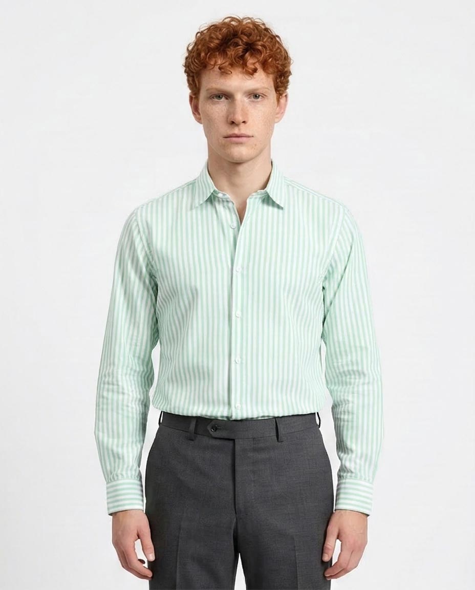 Man wearing a light green striped shirt and dark gray pants on a white background